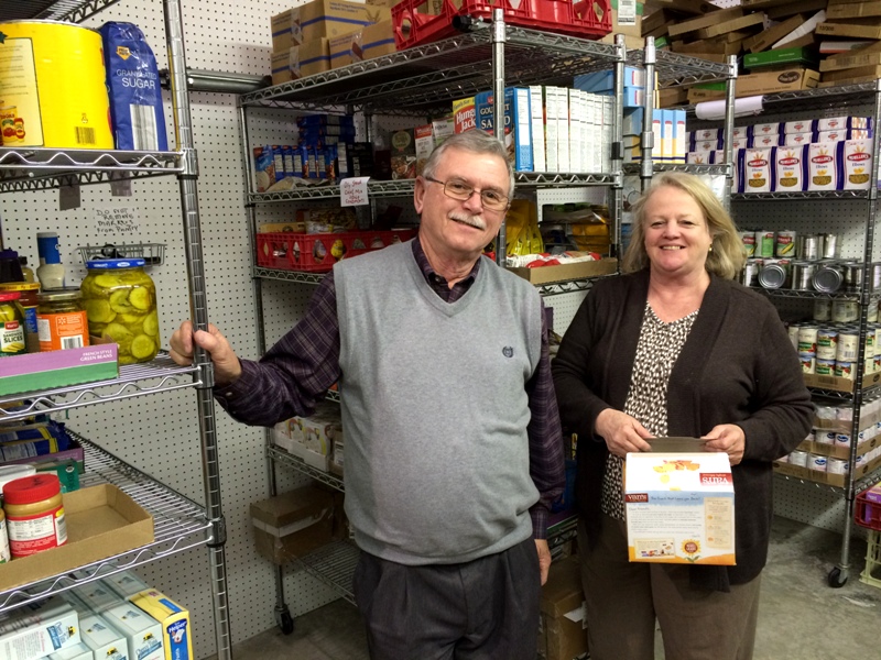 Photo of Tony and Kathy in the food pantry