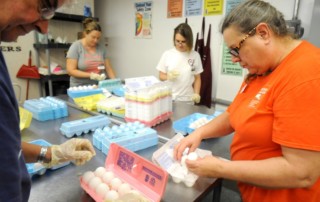 From left, Fred Hammond, Jackie Poist, Jenny Hively and Dona Bey sort eggs at the Food Bank of Central and Eastern N.C.'s Wilmington branch Tuesday, Sept. 14. The team of volunteers repackages up to 20,000 eggs per week for distribution in the Cape Fear region. Paul Stephen/StarNews
