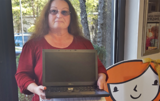 Sandy Marsh, Agency Director of Southern Mission Ministries with her newly obtained discounted computer.