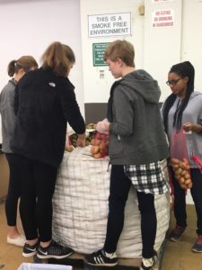 St. Mary's Students bag potatoes on MLK Day at our Durham Branch
