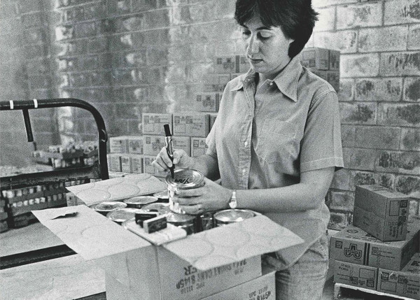 Black and White; Woman labeling a can of yams in 1982