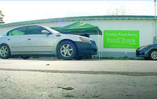 Car parked in front of a building - Trenton Food Pantry